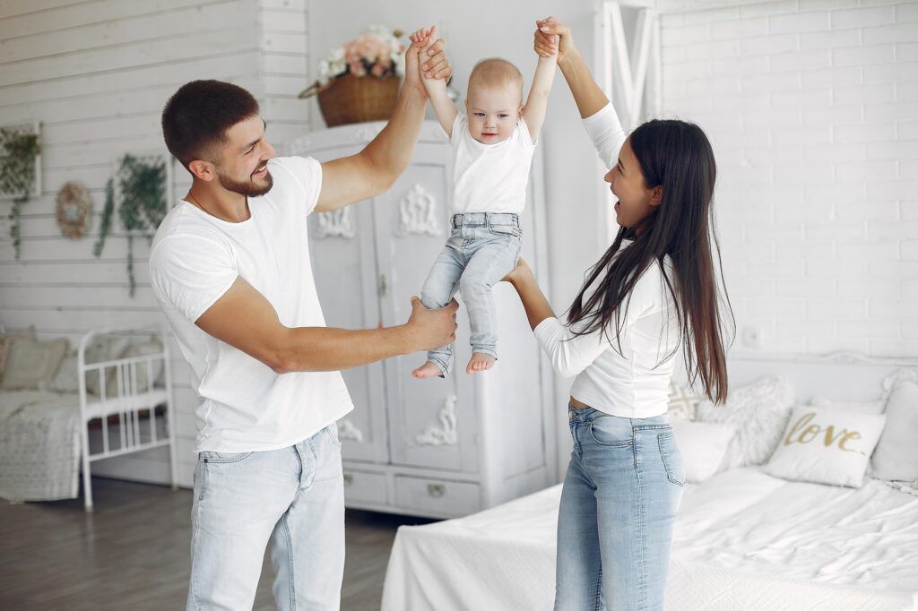 Beautiful family spend time in a bathroom