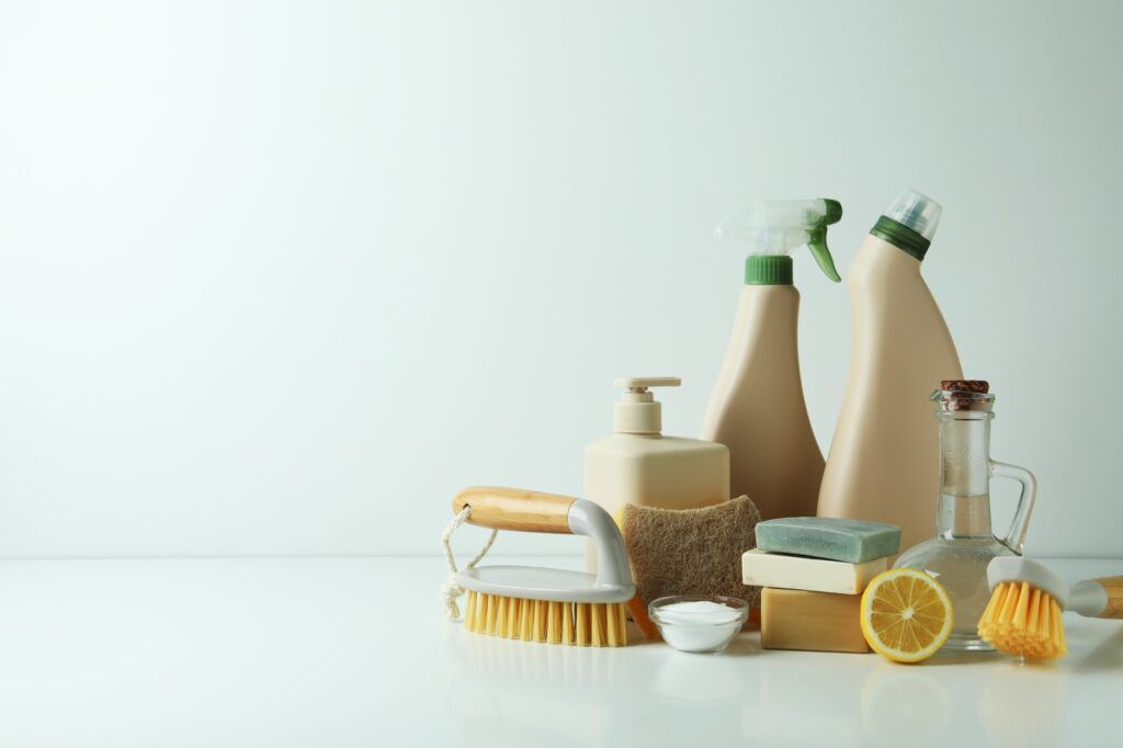 Cleaning concept with eco friendly cleaning tools on white table